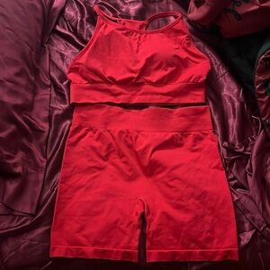 Red workout set includes the sports bra and biker shorts